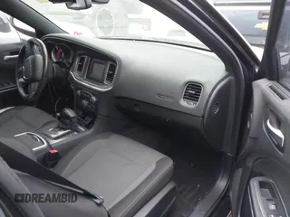 2015 Dodge Charger SE with VIN 2C3CDXBG7FH841469, listed as a IAAI auction lot 42001599 with 103,342 mi miles and . Bid and sale history available at DreamBid. Image 5.