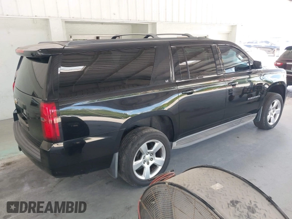 2015 Chevrolet Suburban LT with VIN 1GNSKJKC7FR199544, listed as a IAAI auction lot 42169017 with 219,219 mi miles and . Bid and sale history available at DreamBid. Image 4.