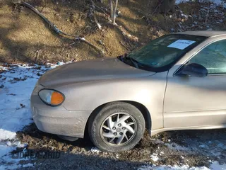 2004 Pontiac Grand Am SE with VIN 1G2NE52F24C231559, listed as a IAAI auction lot 41606544 with 65,524 mi miles. Bid and sale history available at carsss.com. Image 13.