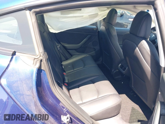 2023 Tesla Model 3 with VIN 5YJ3E1EA1PF431190, listed as a IAAI auction lot 41980007 with 26,164 mi miles and . Bid and sale history available at DreamBid. Image 8.
