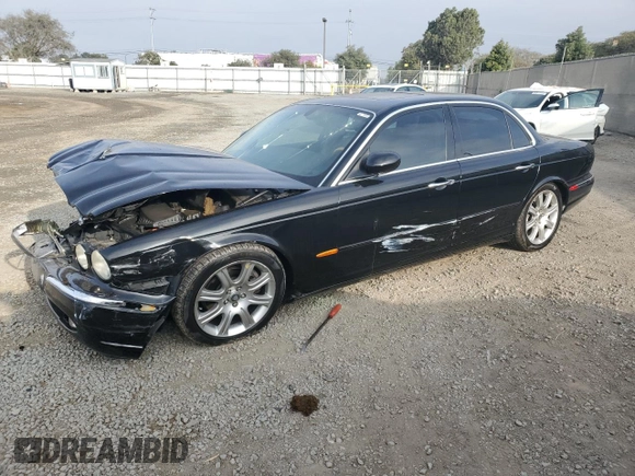2004 Jaguar XJ with VIN SAJEA71C54SG01455, listed as a Copart auction lot 86591014 with 83,977 mi miles and Salvage Title. Bid and sale history available at carsss.com. Image 1.