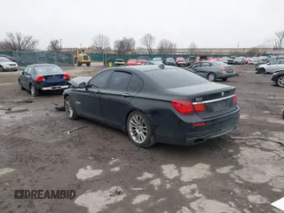 2015 BMW 7 Series 750i xDrive with VIN WBAYB6C59FD965820, listed as a IAAI auction lot 41558215 with 142,617 mi miles. Bid and sale history available at carsss.com. Image 3.