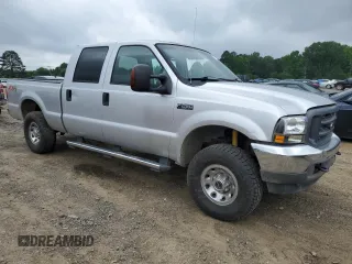2004 Ford F-250 XL with VIN 1FTNW21L94EE03900, listed as a Copart auction lot 57838765 with 185,837 mi miles and Salvage title. Bid and sale history available at DreamBid. Image 4.