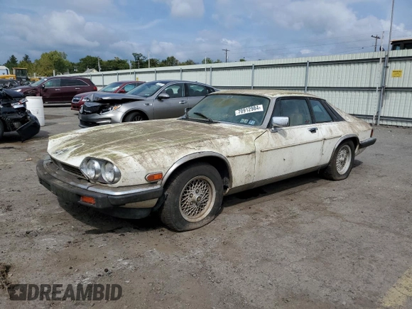 1989 Jaguar XJS z VIN SAJNY584XKC161154, wystawiony jako Copart lot #70912984 z przebiegiem 65 188 mil mil oraz Czysty tytuł • Clean title. Historia ofert i sprzedaży dostępna na DreamBid. Obrazek 1.