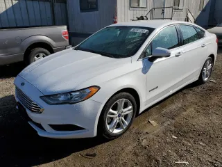 2018 Ford Fusion Hybrid S with VIN 3FA6P0UU3JR225541, listed as a Copart auction lot 85257754 with 141,776 mi miles and Clean Title. Bid and sale history available at carsss.com. Image 1.