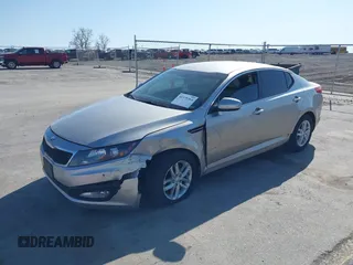 2013 Kia Optima LX with VIN KNAGM4A73D5356339, listed as a IAAI auction lot 41979364 with 140,000 mi miles. Bid and sale history available at carsss.com. Image 2.