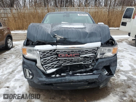 2021 GMC Canyon 4WD Denali with VIN 1GTG6EENXM1199427, listed as a Copart auction lot 86018624 with 98,520 mi miles and Salvage Title. Bid and sale history available at carsss.com. Image 5.
