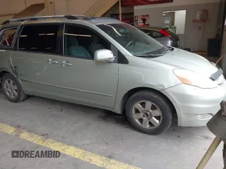 2007 Toyota Sienna XLE with VIN 5TDZK22C37S023719, listed as a IAAI auction lot 41566286 with 239,296 mi miles. Bid and sale history available at carsss.com. Image 1.