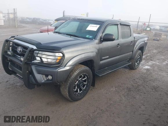 2015 Toyota Tacoma with VIN 3TMLU4EN7FM201302, listed as a IAAI auction lot 41666606 with 200,504 mi miles and . Bid and sale history available at DreamBid. Image 2.