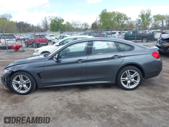 2015 BMW 4 Series 428i xDrive z VIN WBA4A7C5XFD415131, wystawiony jako IAAI lot #42100618 z przebiegiem 89 093 mil mil oraz . Historia ofert i sprzedaży dostępna na DreamBid. Obrazek 14.