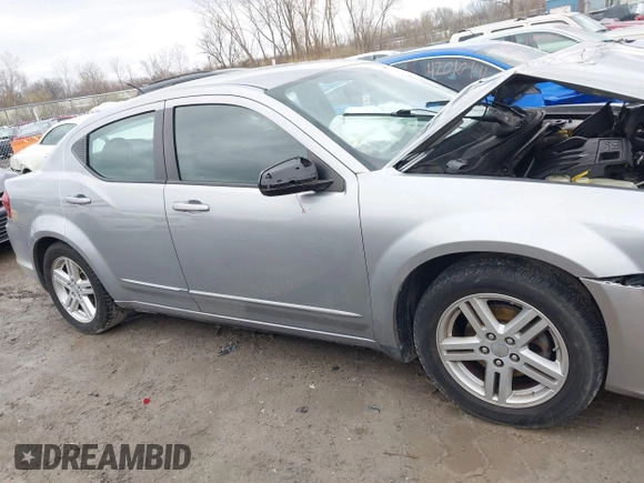 2013 Dodge Avenger SXT with VIN 1C3CDZCB2DN665997, listed as a IAAI auction lot 42011394 with Not Provided miles and . Bid and sale history available at carsss.com. Image 13.