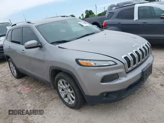 2018 Jeep Cherokee Latitude with VIN 1C4PJLCX4JD559096, listed as a IAAI auction lot 41925282 with 127,488 mi miles and . Bid and sale history available at DreamBid. Image 1.