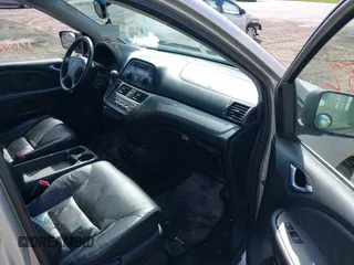 2007 Honda Odyssey Touring with VIN 5FNRL38827B045088, listed as a IAAI auction lot 42088752 with 224,655 mi miles. Bid and sale history available at carsss.com. Image 5.
