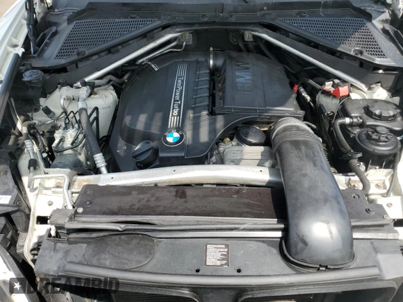 2012 BMW X5 35i with VIN 5UXZV4C54CL763857, listed as a Copart auction lot 57943195 with 143,522 mi miles and Salvage title. Bid and sale history available at DreamBid. Image 12.