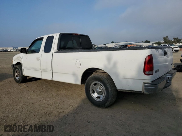 1999 Ford F-150 XL with VIN 1FTRX17L6XNA06844, listed as a Copart auction lot 83109004 with Not Provided miles and Salvage Title. Bid and sale history available at carsss.com. Image 2.