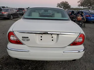 2004 Jaguar XJ with VIN SAJWA71C14SG16264, listed as a Copart auction lot 83251554 with 267,493 mi miles and Salvage Title. Bid and sale history available at carsss.com. Image 6.