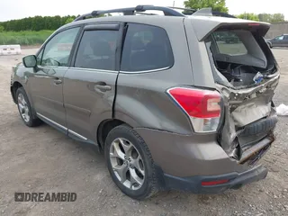2017 Subaru Forester Touring z VIN JF2SJAWC6HH529707, wystawiony jako IAAI lot #42401138 z przebiegiem 172 868 mil mil oraz . Historia ofert i sprzedaży dostępna na DreamBid. Obrazek 3.