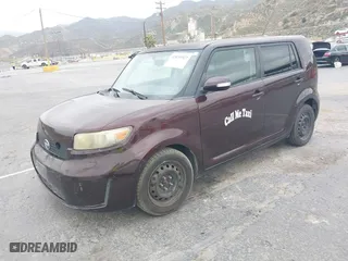 2009 Scion xB with VIN JTLKE50E291081243, listed as a IAAI auction lot 42033327 with 263,903 mi miles. Bid and sale history available at carsss.com. Image 2.
