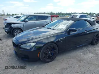 2014 BMW M6 z VIN WBSLZ9C52EDZ78748, wystawiony jako IAAI lot #42152435 z przebiegiem 57 150 mil mil oraz . Historia ofert i sprzedaży dostępna na DreamBid. Obrazek 2.