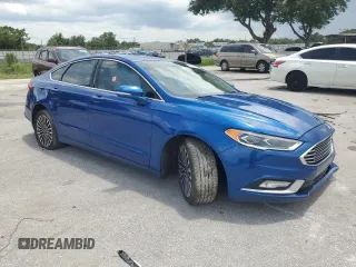 2018 Ford Fusion Titanium with VIN 3FA6P0D97JR219690, listed as a Copart auction lot 63773595 with 138,066 mi miles and Salvage title. Bid and sale history available at DreamBid. Image 4.