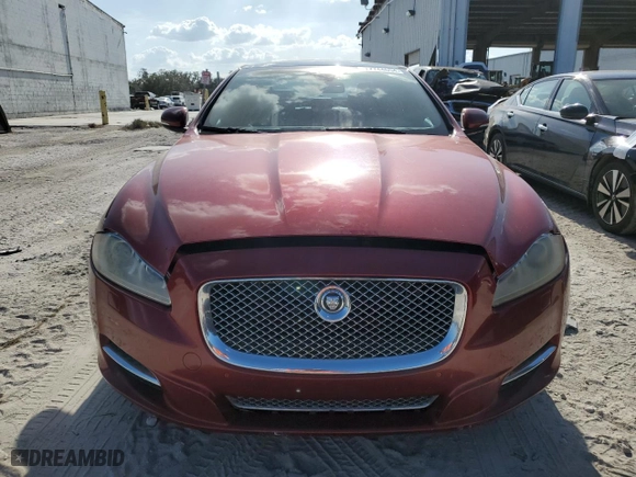 2013 Jaguar XJ with VIN SAJWJ1CD9D8V48888, listed as a Copart auction lot 77744654 with NaN miles and Clean Title. Bid and sale history available at carsss.com. Image 5.