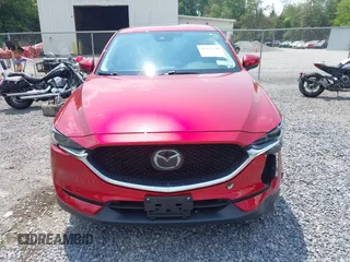 2021 Mazda CX-5 Grand Touring with VIN JM3KFBDM3M0434569, listed as a IAAI auction lot 42422349 with 25,924 mi miles and . Bid and sale history available at DreamBid. Image 12.
