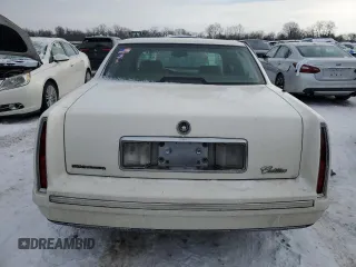 1998 Cadillac DeVille with VIN 1G6KD54YXWU765831, listed as a Copart auction lot 88877175 with 0 mi miles and Salvage Title. Bid and sale history available at carsss.com. Image 6.