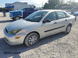 2003 Ford Focus LX z VIN 1FAFP33P93W312311, wystawiony jako Copart lot #63250405 z przebiegiem 80 148 mil mil oraz Szkoda całkowita • Salvage title. Historia ofert i sprzedaży dostępna na DreamBid. Obrazek 1.