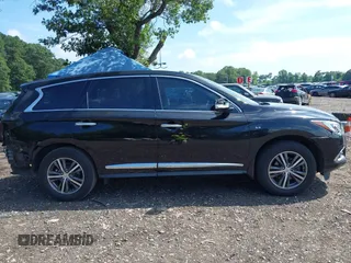 2019 Infiniti QX60 Luxe with VIN 5N1DL0MM0KC515759, listed as a IAAI auction lot 42743015 with 69,863 mi miles and . Bid and sale history available at DreamBid. Image 13.