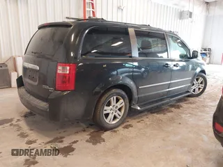 2010 Dodge Grand Caravan Crew with VIN 2D4RN6DX1AR438135, listed as a IAAI auction lot 41734378 with 57,041 mi miles and . Bid and sale history available at DreamBid. Image 4.