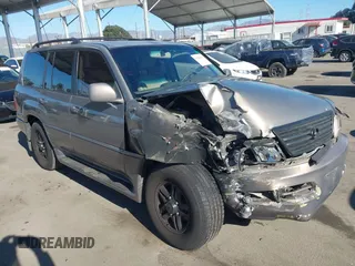 1999 Lexus LX 470 z VIN JT6HT00W5X0075986, wystawiony jako IAAI lot #41228035 z przebiegiem 163 548 mil mil oraz . Historia ofert i sprzedaży dostępna na DreamBid. Obrazek 1.