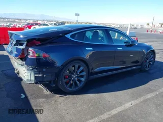 2014 Tesla Model S 60 with VIN 5YJSA1H14EFP57209, listed as a IAAI auction lot 41305157 with 141,364 mi miles and . Bid and sale history available at DreamBid. Image 4.