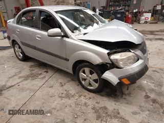 2009 Kia Rio LX with VIN KNADE223596444133, listed as a IAAI auction lot 41598865 with Not Provided miles and . Bid and sale history available at DreamBid. Image 1.