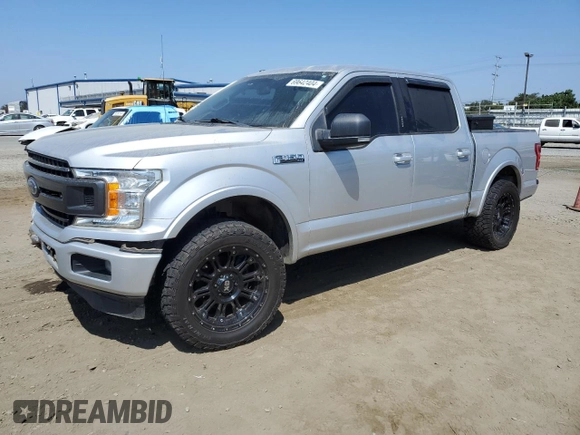 2018 Ford F-150 XL with VIN 1FTEW1CGXJFB40297, listed as a Copart auction lot 69642404 with 92,561 mi miles and Salvage title. Bid and sale history available at DreamBid. Image 1.