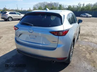 2021 Mazda CX-5 Grand Touring with VIN JM3KFBDM3M1300316, listed as a IAAI auction lot 41878520 with 77,670 mi miles and . Bid and sale history available at DreamBid. Image 4.