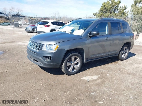 2012 Jeep Compass Latitude with VIN 1C4NJDEB6CD562986, listed as a IAAI auction lot 41813858 with 144,068 mi miles. Bid and sale history available at carsss.com. Image 2.