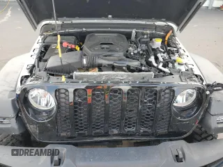 2023 Jeep Wrangler z VIN 1C4JJXN64PW630179, wystawiony jako Copart lot #53879415 z przebiegiem 27 905 mil mil oraz Czysty tytuł • Clean title. Historia ofert i sprzedaży dostępna na DreamBid. Obrazek 11.
