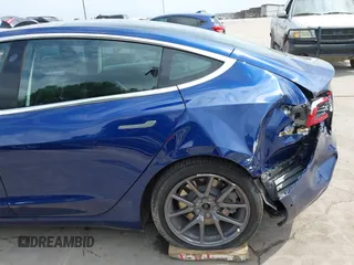 2019 Tesla Model 3 Mid Range with VIN 5YJ3E1EA5KF190453, listed as a IAAI auction lot 41880684 with 58,909 mi miles and . Bid and sale history available at carsss.com. Image 20.