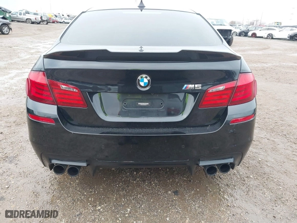 2013 BMW M5 with VIN WBSFV9C51DD095750, listed as a IAAI auction lot 40907304 with 93,014 mi miles. Bid and sale history available at carsss.com. Image 16.