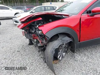2023 Mazda CX-30 S Premium with VIN 3MVDMBDM1PM520048, listed as a IAAI auction lot 42468172 with 7,277 mi miles and . Bid and sale history available at DreamBid. Image 6.