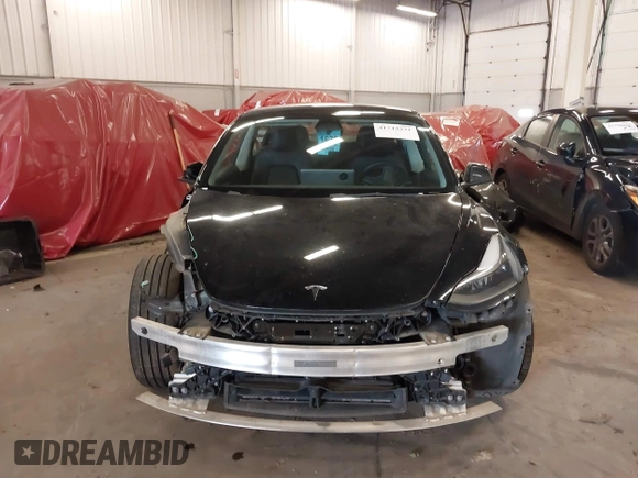 2022 Tesla Model 3 with VIN 5YJ3E1EA4NF187113, listed as a IAAI auction lot 41712331 with 81,879 mi miles and . Bid and sale history available at DreamBid. Image 13.