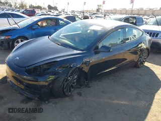 2021 Tesla Model 3 Performance with VIN 5YJ3E1EC6MF999321, listed as a IAAI auction lot 41417451 with 20,562 mi miles and . Bid and sale history available at carsss.com. Image 2.