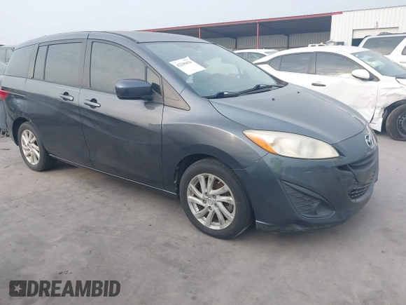 2012 Mazda 5 Sport with VIN JM1CW2BL6C0134921, listed as a IAAI auction lot 42290476 with 128,490 mi miles and . Bid and sale history available at DreamBid. Image 1.