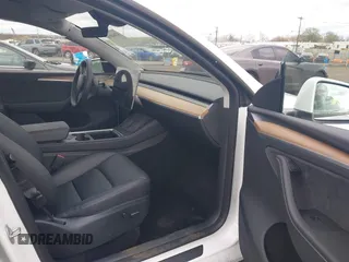 2023 Tesla Model Y Long Range with VIN 7SAYGDEE3PA201719, listed as a IAAI auction lot 42048816 with Not Provided miles and . Bid and sale history available at DreamBid. Image 5.