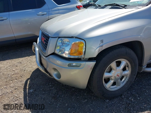 2004 GMC Envoy SLE with VIN 1GKDT13S042113411, listed as a IAAI auction lot 42117824 with 116,827 mi miles. Bid and sale history available at carsss.com. Image 6.