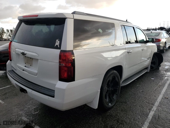 2015 Chevrolet Suburban LS with VIN 1GNSCHKC9FR667540, listed as a Copart auction lot 80908574 with 125,428 mi miles and Salvage Title. Bid and sale history available at carsss.com. Image 3.