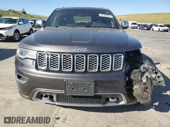 2017 Jeep Grand Cherokee Overland with VIN 1C4RJFCG9HC601806, listed as a Copart auction lot 61786275 with 122,898 mi miles and Salvage title. Bid and sale history available at DreamBid. Image 5.