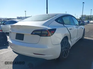 2023 Tesla Model 3 with VIN 5YJ3E1EA6PF411940, listed as a IAAI auction lot 41829537 with 32,877 mi miles and . Bid and sale history available at carsss.com. Image 4.