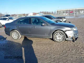 2010 Ford Fusion Hybrid with VIN 3FADP0L39AR125251, listed as a IAAI auction lot 41100606 with 235,612 mi miles. Bid and sale history available at carsss.com. Image 13.