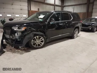 2021 Chevrolet Traverse High Country with VIN 1GNEVNKW9MJ150993, listed as a IAAI auction lot 41224329 with 100,425 mi miles. Bid and sale history available at carsss.com. Image 2.